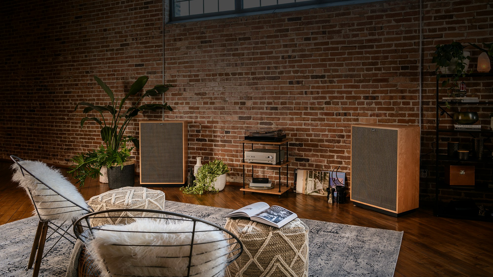Cornwall IV speakers in a turntable listening configuration with a cozy seating area in front